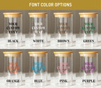 a collection of glass jars with wooden lids, each with a custom text label. The jars are arranged in a grid with two rows and three columns. The text labels on the jars are "YOUR CUSTOM TEXT" and include colors such as "BLACK", "WHITE", "BROWN", "GREEN", "ORANGE", "BLUE", and "PINK".